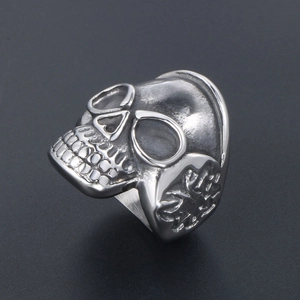 Vintage skull ring in silver-tone titanium steel with detailed side relief carvings