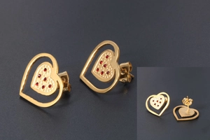 Detail of 18K gold heart studs with textured inner layer and red zircon accents