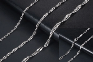 Detailed view of silver water ripple chain featuring a secure lobster clasp closure