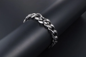 Macro shot of Gothic snake scale textures on a vintage titanium steel cuban link bracelet