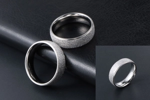 Macro view of matte sandblasted finish and polished inner band on titanium rings