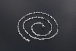 Detailed view of silver water wave chain necklace with a secure lobster clasp closure