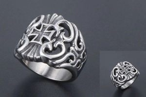 Detailed view of vintage gothic cross ring with intricate hollowed patterns in steel