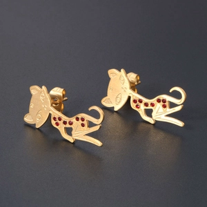 Elegant 18K rose gold plated cat earrings with sparkling red crystals on black background
