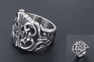 Macro shot of retro gothic steel ring featuring hollow engraving and iron cross detail