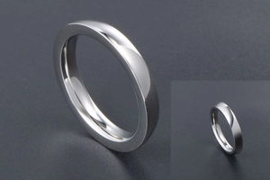 Close-up of high-polished stainless steel minimalist ring with smooth silver metallic finish