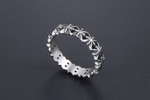 Macro view of vintage Gothic ring with oxidized silver finish and star pattern details