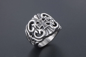 Detail of gothic cross ring with vintage hollow-out floral patterns and silver finish