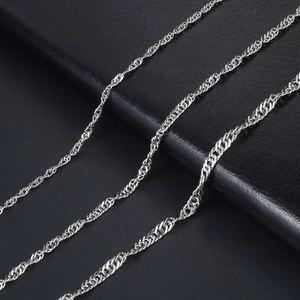 Polished silver water wave chain necklace with detailed spiral twist texture on black leather