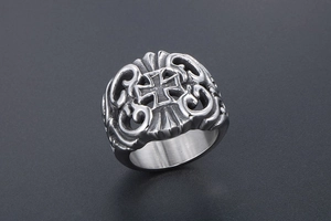 Macro detail of men's vintage stainless steel ring with gothic hollow cross carving