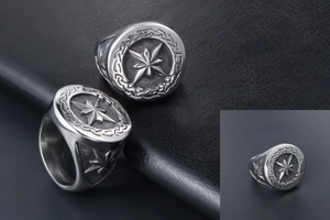 Macro detail of vintage octagonal star signet ring with Celtic knotwork on black leather