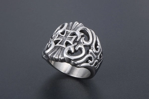 Close-up of vintage steel ring featuring iron cross and gothic filigree details