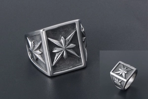 Macro view of vintage stainless steel square ring with embossed octagonal star detail