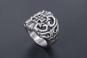 Close-up of vintage gothic titanium steel ring with hollow cross and filigree details
