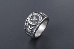 Macro detail of vintage punk ring showing embossed octagonal star and honeycomb texture