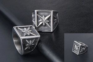 Detail of vintage steel square ring featuring embossed polar star patterns on black leather
