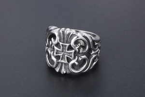Macro shot of silver gothic ring featuring hollow vine patterns and a vintage cross design