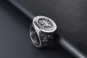 Macro shot of retro stainless steel ring featuring octagonal star and Celtic knot details