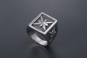 Detail view of vintage stainless steel signet ring with polar star engraving and brushed finish