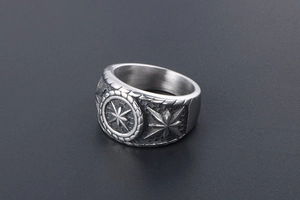 Macro detail of retro punk compass ring showing oxidized finish and intricate carvings
