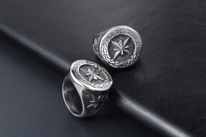 Detailed close-up of retro silver rings featuring star engravings and Celtic patterns