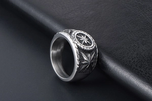 Close-up of vintage octagonal star engraving on a brushed metal men's punk ring