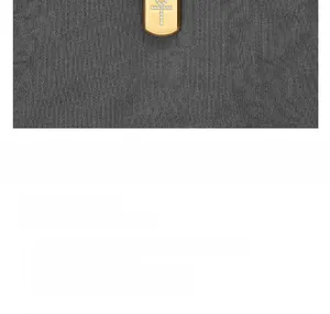 Detailed view of golden Ankh pendant with pavé setting and brushed metal finish