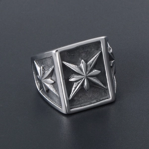 Vintage men's stainless steel signet ring with engraved octagonal star and industrial style