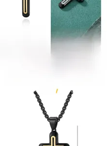 Close-up of black titanium steel cross pendant with gold U-shaped inlay details