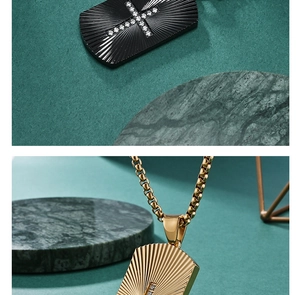 Macro detail of rectangle dog tag pendant with sunburst texture and CZ cross inlay