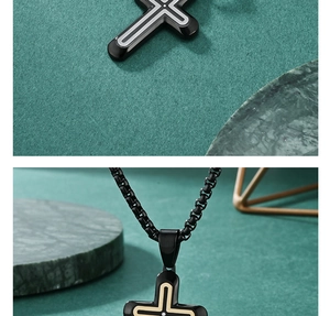 Detailed macro of a black cross pendant with silver trim and center zircon stone