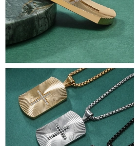Macro view of CNC set stones on radiating sunburst texture steel military pendant
