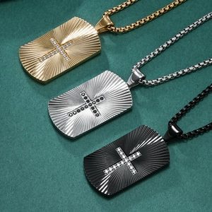 Three men's dog tag necklaces with radial fan patterns and inset crystal crosses