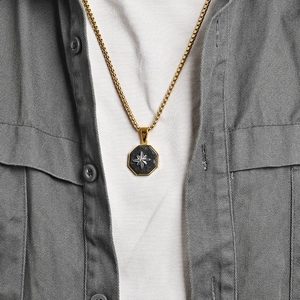 Men's gold box chain necklace with a black carbon fiber octagonal star pendant