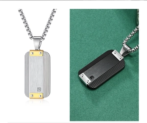 Detailed view of brushed stainless steel dog tag necklace with a square cubic zirconia stone