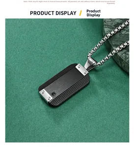 Close-up of black rectangular pendant with horizontal grooves and silver metal trim