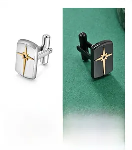 Detailed macro of stainless steel cufflinks featuring a gold starburst and black gemstone