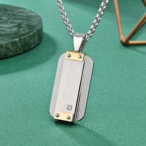 Minimalist stainless steel military tag necklace with brushed texture and gold accents