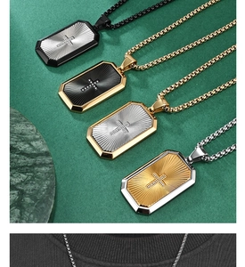 Macro detail of cross pendant with sunray texture and diverse dual-tone plating options