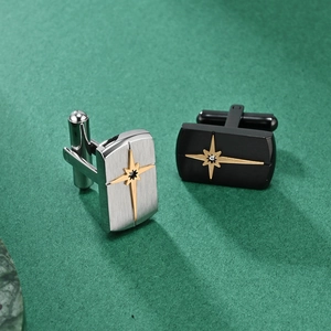 Mens stainless steel cufflinks with gold starburst accent in silver and black finish