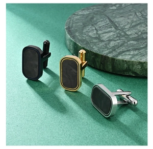 Detailed display of minimalist forged carbon fiber cufflinks in gold, silver, and black