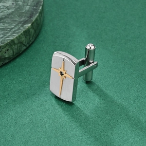 Men's rectangular stainless steel cufflinks with brushed texture and gold star detail