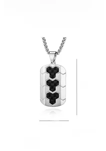 Detail of steel necklace pendant with hexagon carbon fiber inlay 35x22mm size