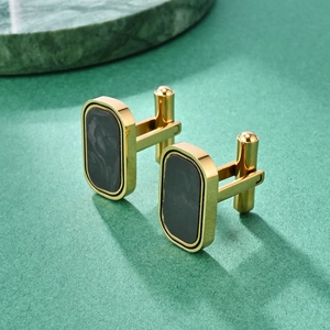 French gentleman's gold cufflinks with rectangular black marble inlay on dark textured base