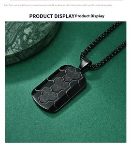 Close-up of black pendant with carbon fiber hexagonal texture and industrial steel finish