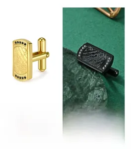 Detailed macro view of CNC diamond-set french cufflinks with textured bark pattern engraving