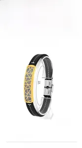 Detail view of 220mm black titanium steel bracelet with gold geometric hollow pattern