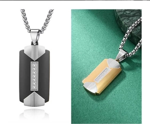 Close-up of men's geometric two-tone steel pendants with vertical inset crystals and chains