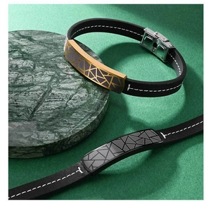 Macro view of geometric engraved metal plates on black leather bracelets for men