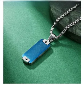 Detail view of rectangular hip-hop pendant with blue brushed metal panel and silver screws